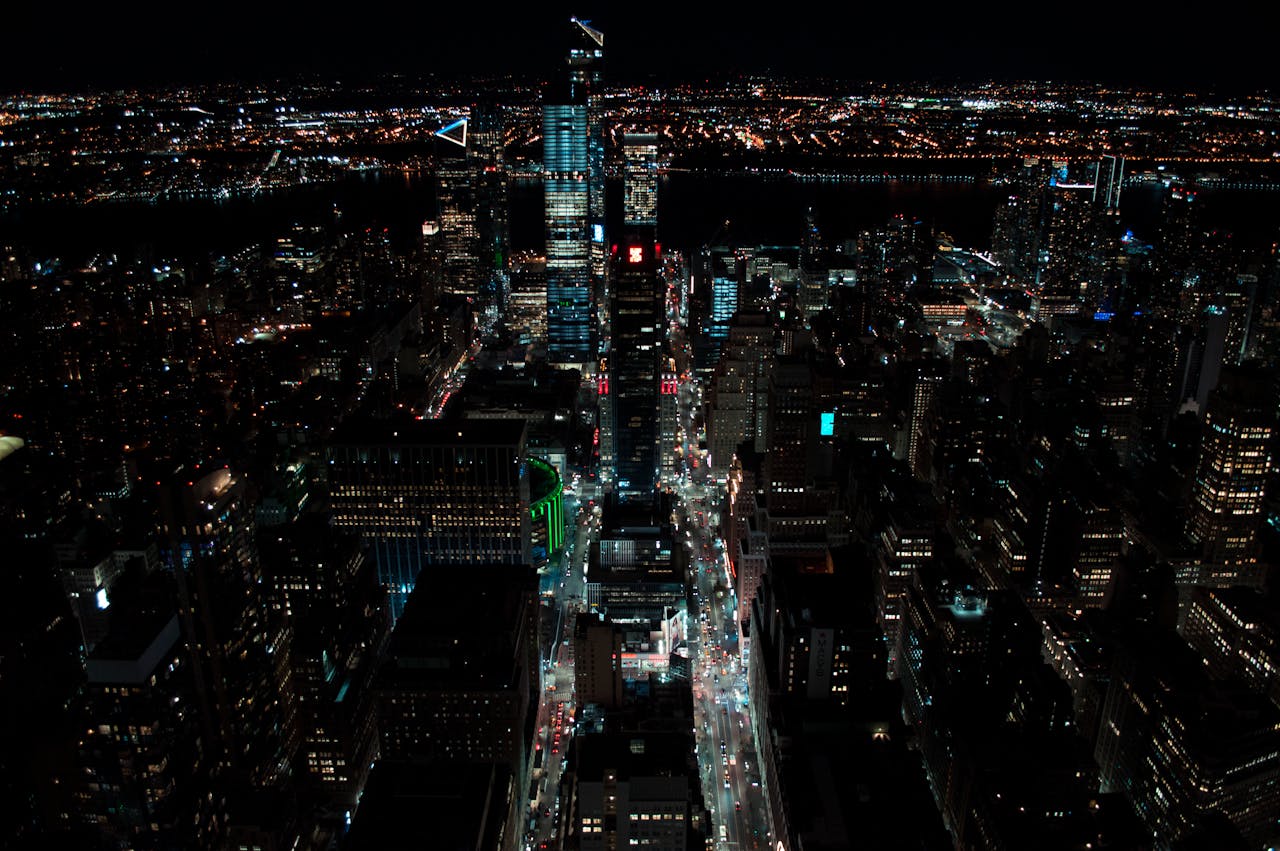 A breathtaking aerial view of New York City at night, featuring vibrant city lights and skyscrapers.
