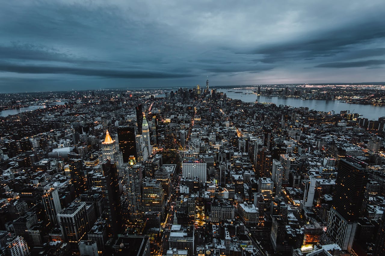 Stunning aerial view of New York City's skyscrapers and skyline at dusk, showcasing the urban landscape.